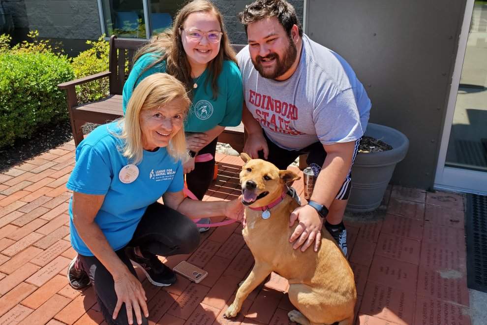 adopters with dog Abby